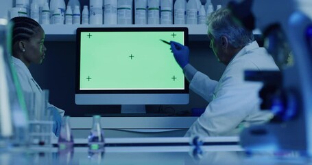 Aufkleber - Researchers analyze and discuss the results of an experiment. Doctors sitting in lab looking at results on a blank green computer screen. Male scientist explaining diagnosis to female colleague.