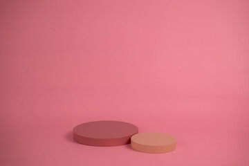 Poster - Empty podium for display cosmetic product. Platform arrangement in pink pastel color in trendy minimalist style. Composition of cylinders and cubes layout for feminine background