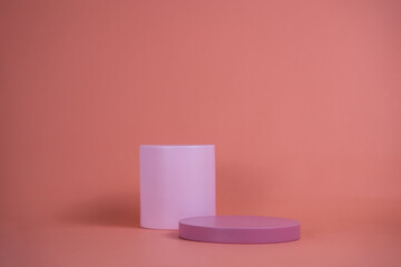 Poster - Empty podium for display cosmetic product. Platform arrangement in pink pastel color in trendy minimalist style. Composition of cylinders and cubes layout for feminine background