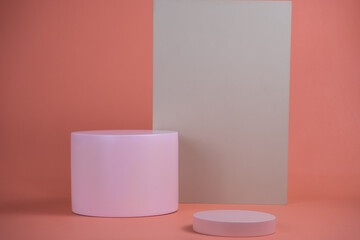 Poster - Empty podium for display cosmetic product. Platform arrangement in pink pastel color in trendy minimalist style. Composition of cylinders and cubes layout for feminine background