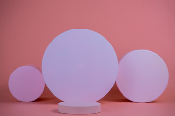 Poster - Empty podium for display cosmetic product. Platform arrangement in pink pastel color in trendy minimalist style. Composition of cylinders and cubes layout for feminine background