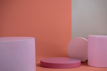 Poster - Empty podium for display cosmetic product. Platform arrangement in pink pastel color in trendy minimalist style. Composition of cylinders and cubes layout for feminine background