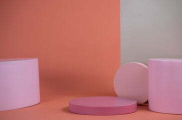 Poster - Empty podium for display cosmetic product. Platform arrangement in pink pastel color in trendy minimalist style. Composition of cylinders and cubes layout for feminine background