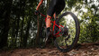 © VStudio - Asian man rides MTB, mountain bike downhill in the wild to extremes. Extreme Sport and MTB, mountain bike downhill Concept. selective focus on the cyclist's legs.