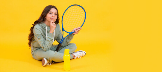 thinking child with tennis racquet. teen girl after sport training. dedicated to fitness. Horizontal poster of isolated child face, banner header, copy space.