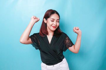 Wall Mural - Portrait of sleepy attractive Asian woman wearing pajamas, just waking up after night without sleep