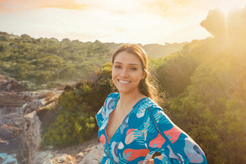 young woman in summer dress at cliff waterfront on Mallorca