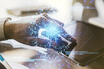 Poster - Double exposure of creative code skull hologram and finger clicks on a digital tablet on background. Malware and cyber crime concept