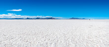 Sunny View Of The Bonneville Salt Flats In Utah, A Unique Natural Environment Of Salt Looking Like White Sand, A Popular Place For Breaking Speed Records And Races