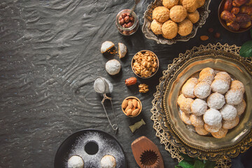 Wall Mural - Arabic Cuisine; Cookies for celebration of El-Fitr Islamic Feast(The Feast that comes after Ramadan). Top view with copy space.