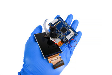 Electronics hazardous waste in a hand on white background