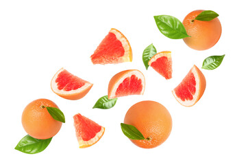 Wall Mural - Tasty ripe grapefruits and green leaves falling on white background