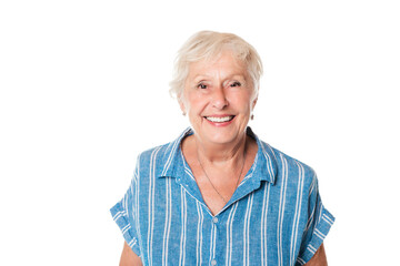 Wall Mural - smiling retired senior woman looking at camera isolated on white background