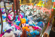 Fairground attraction catching stuffed toys 