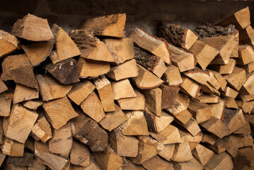 Wall Mural - Stacked firewood. Preparation of firewood for the winter