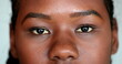 © Marco - African girl eyes staring camera. Macro close-up Mixed race young woman eye, casual real person