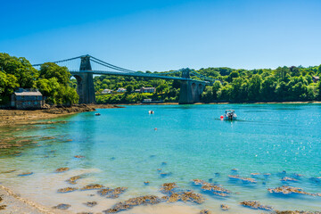 Menai Suspension Bridge over Menai Strait between the island of Anglesey and mainland Wales