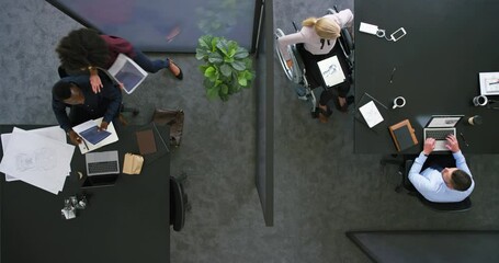 Aufkleber - Overhead of inclusive colleagues having a meeting in a modern office. Above a busy workplace, coworkers brainstorm and develop new strategies for a startup business, unity and innovation at work