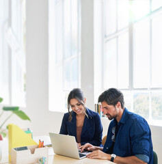 two business people using laptop computer colleagues working in office sharing ideas