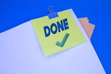 Poster - Done text with Checkmark. Text on adhesive note paper. Event, celebration reminder message.