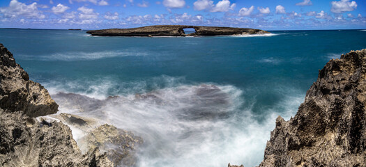 Wall Mural - laie sea arch and rocky cliff beach in oahu hawaii