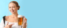 Beautiful Woman In Traditional German Costume And With Mug Of Beer On Blue Background With Space For Text