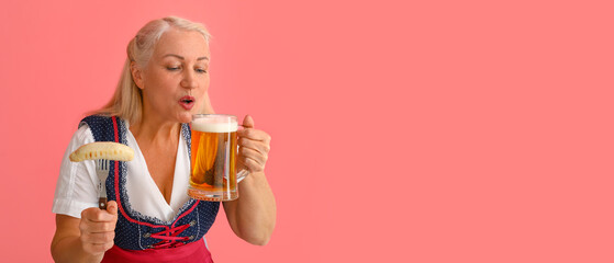 Poster - Oktoberfest woman with beer and sausage on pink background with space for text