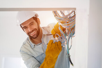 Fototapete - Electrician working on building site,Repairing light at home,repair work.