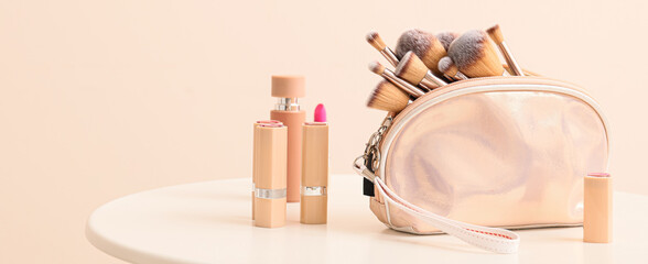 Wall Mural - Set of makeup brushes with decorative cosmetics on table