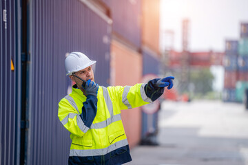 Poster - Technicians using walkie talkie checking stock for loading in the container yard warehouse,Logistic shipping yard business.