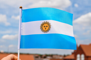Wall Mural - white and blue national flag with sun of Argentina close up