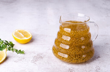 Wall Mural - Yellow drink with seeds in a glass