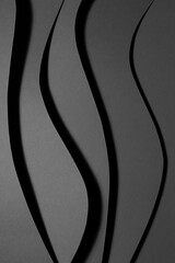 Poster - dark graphite grey abstract textured geometric relievo stepped background with fly vertical curved w