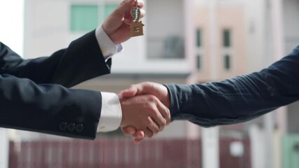 Wall Mural - Real estate agent shakes hands with customer. The house is sold successfully after the customer agrees to sign a house building contract. Mortgage, rent, buy, sell, purchase,move,Selling home.