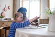 © zinkevych - A girl with down syndrome having a lesson with her teacher and looking involved