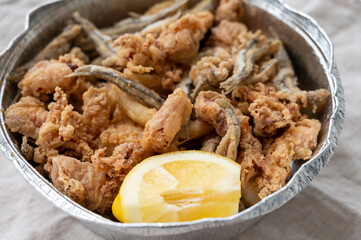 Poster - Spanish sea food, cripsy deep fried baby octopus, fish, calamari rings served with lemon