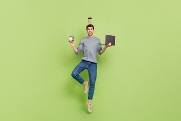 Aufkleber - Full body image photo of workaholic early morning businessman doing multitasks during work hours isolated on green color background