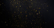 Leinwandbild Motiv Gold glitter shimmer dust shiny lights particles dark abstract background