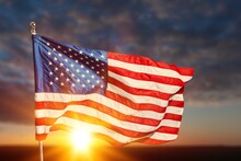 American Flag Waving In The Sunrise. American Flag For Memorial Day,4th Of July,Labour Day.Independence Day Concept.