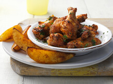 Spicy Chicken Wings And Potato Wedges