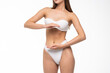 © F8  \ Suport Ukraine - Close up view of stomach. Beautiful woman with slim body in underwear on white background.