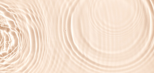 Wall Mural - water texture ripples wave clean transparent water abstract background in beige color