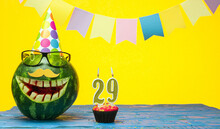 Funny Watermelon In Festive Garlands For Happy Birthday Greetings Funny. Copy Space Watermelon With Smile Character. Happy Birthday With Number 29