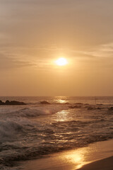 Wall Mural - Ocean waves at sunset in Sri Lanka