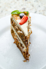Wall Mural - Carrot cake on a white plate macro close up selective focus