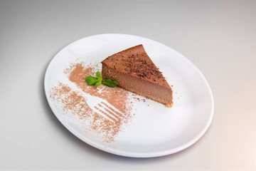 Wall Mural - Tasty sweet cake on white ceramic plate. Popular dessert in minimal style