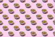Pattern. Cat dry food in a bowl  on a pink background. The concept of a diet for pets, the choice of food for cats.
