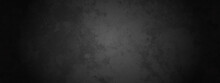 Dark Black Grunge Textured Concrete Background. Panorama Dark Grey Black Slate Background. Dark Grunge Textured Wall Closeup Background.  Old Black Background. Blackboard. Chalkboard Texture.