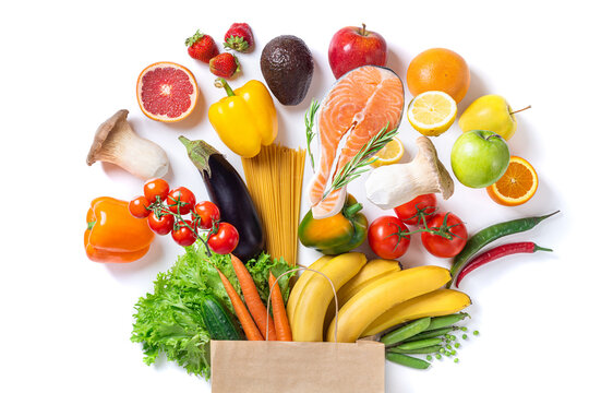 healthy food background. healthy food in paper bag fish, vegetables and fruits on white. shopping fo
