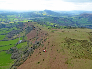 Poster - Paragliders flying above the ridge at Pandy, Wales	